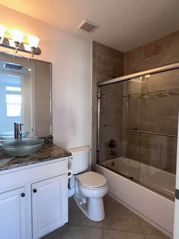 a view of an empty room and fire place