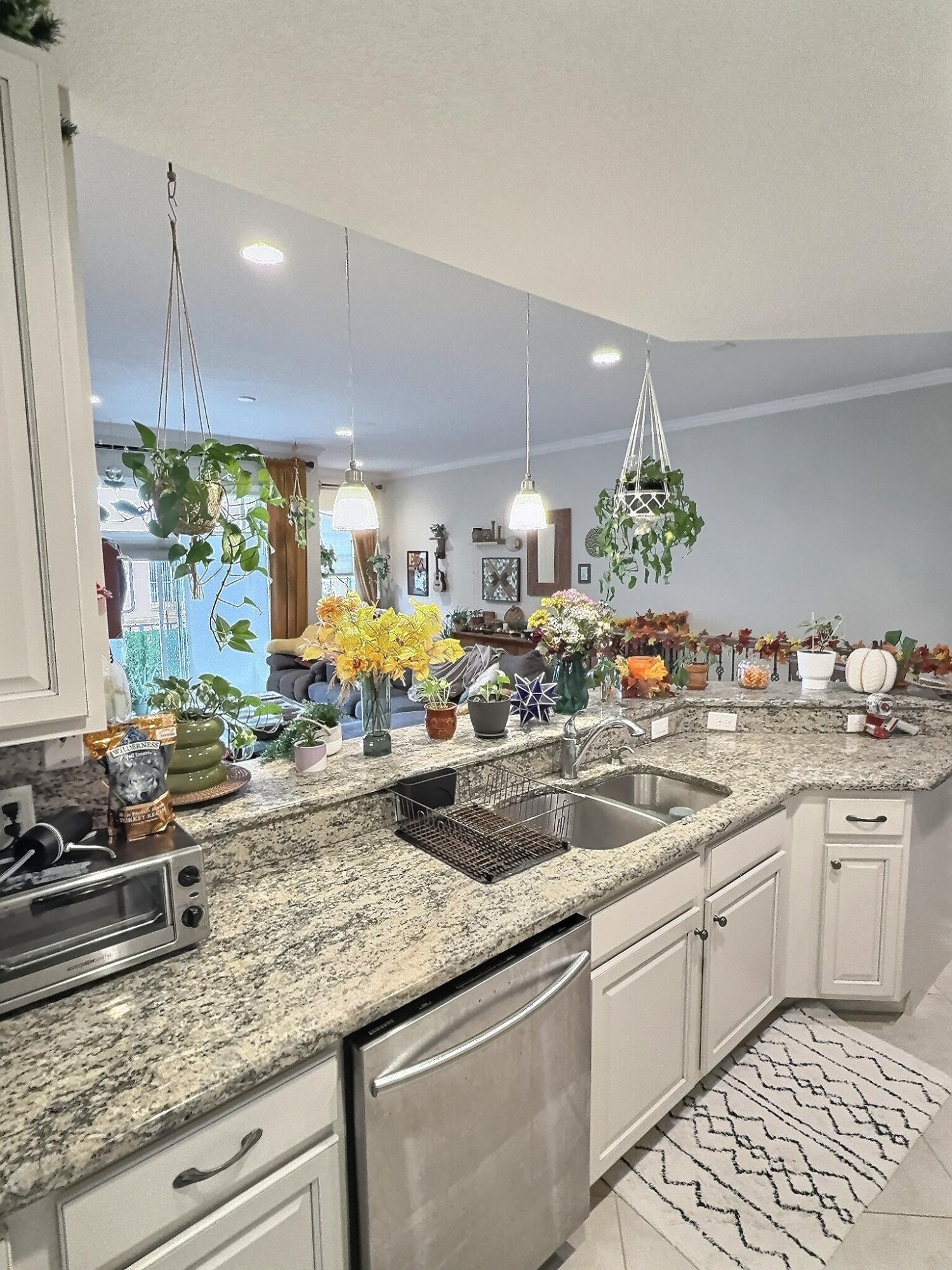 10320 Southwest Stephanie Way, Unit 7210 Port St. Lucie, FL 34987 - Photo 3 of 15 a kitchen with lots of counter top space and a sink