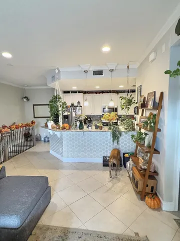 a living room with lots of furniture and a table