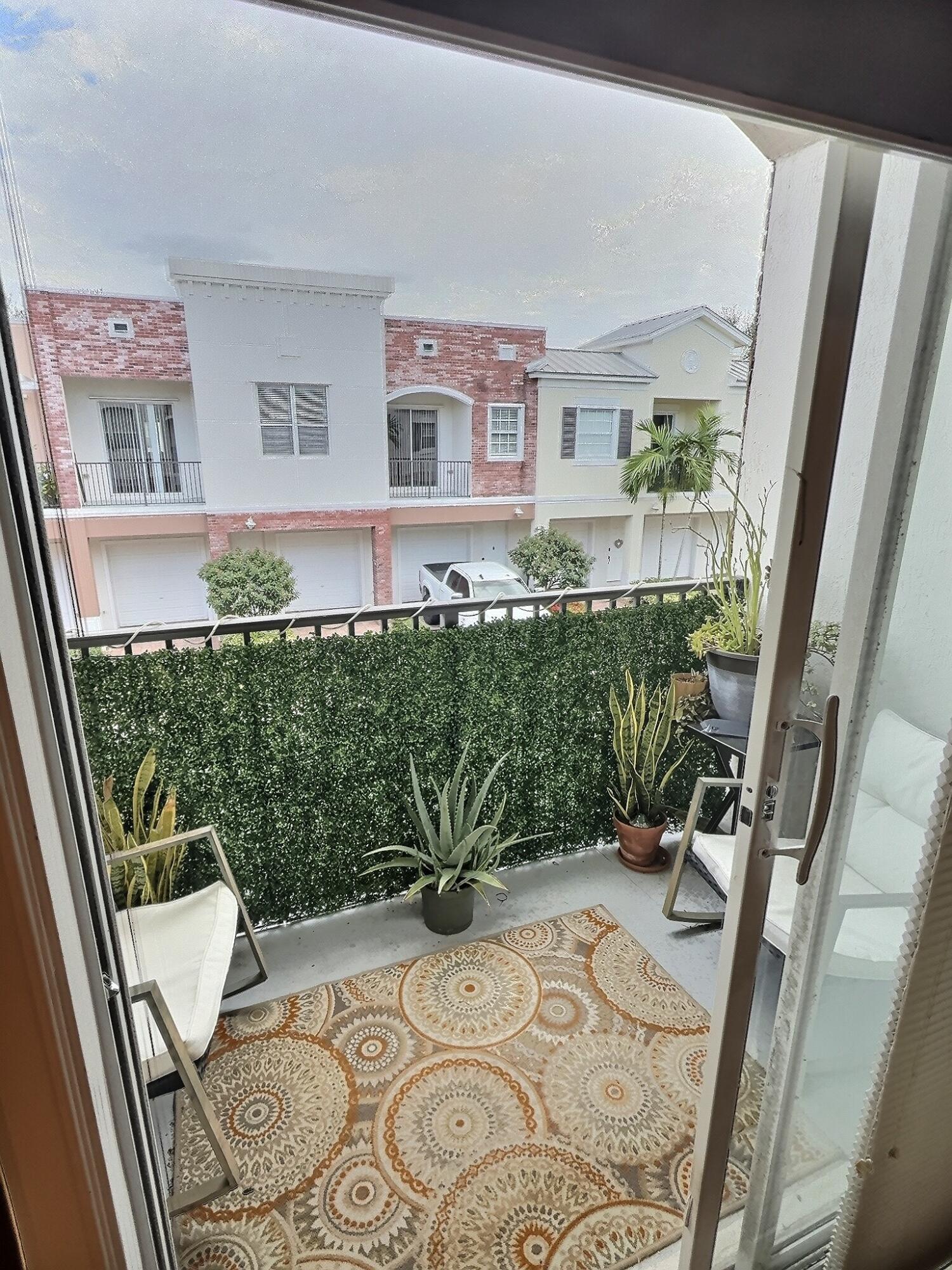 10320 Southwest Stephanie Way, Unit 7210 Port St. Lucie, FL 34987 - Photo 6 of 15 a view of balcony with furniture