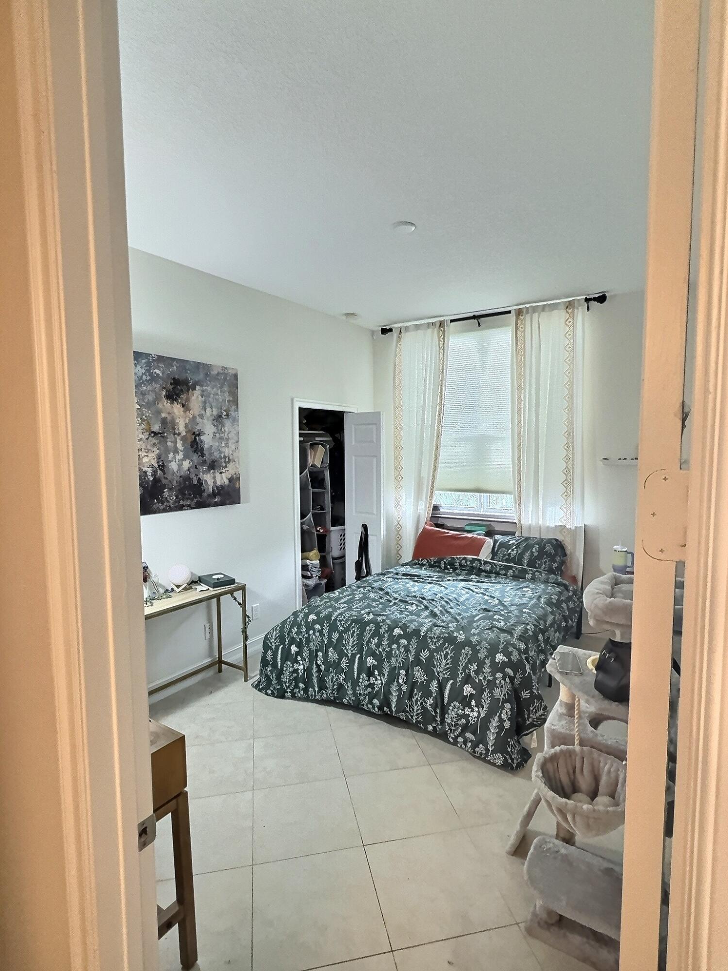 10320 Southwest Stephanie Way, Unit 7210 Port St. Lucie, FL 34987 - Photo 7 of 15 a room with a couch and chair