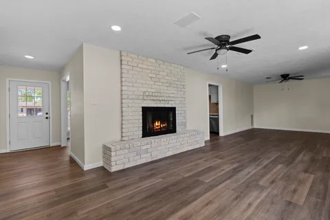 a view of livingroom with hardwood floor and a ceiling fan