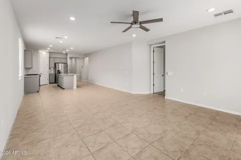 a view of a kitchen with a sink and stainless steel appliances