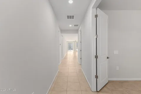 a view of a hallway with a white walls