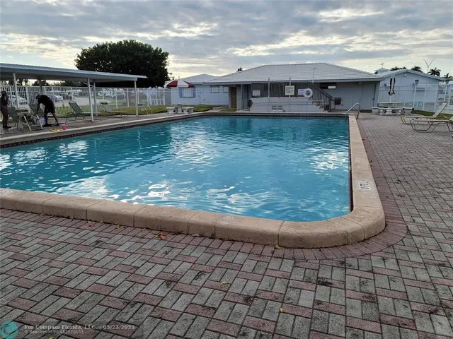 a swimming pool view with a lake view