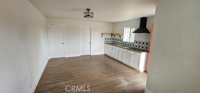 14639 Lilac Street Hesperia, CA 92345 - Photo 11 of 12 a kitchen with granite countertop a stove and a refrigerator