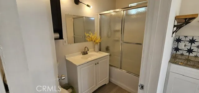 a bathroom with a sink and mirror