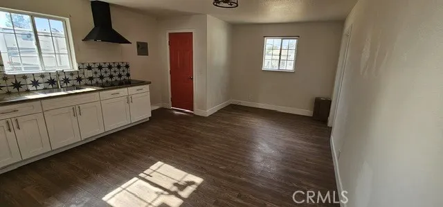 a kitchen with sink and cabinets
