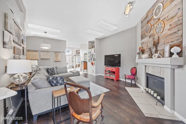 a dining room with furniture a chandelier and a rug