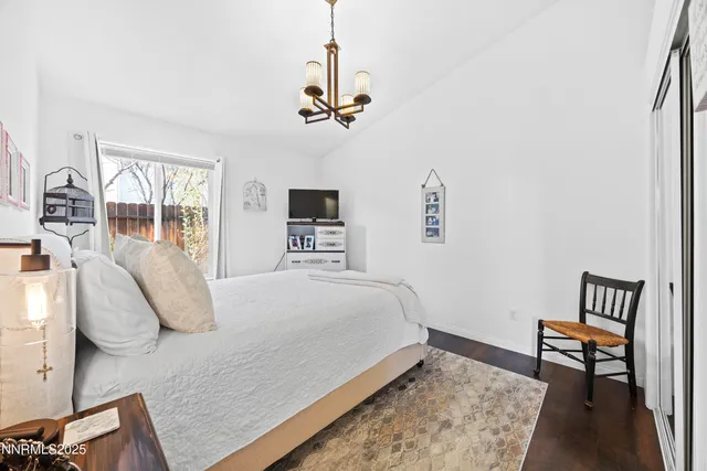 a bathroom with a sink a toilet a mirror and shower