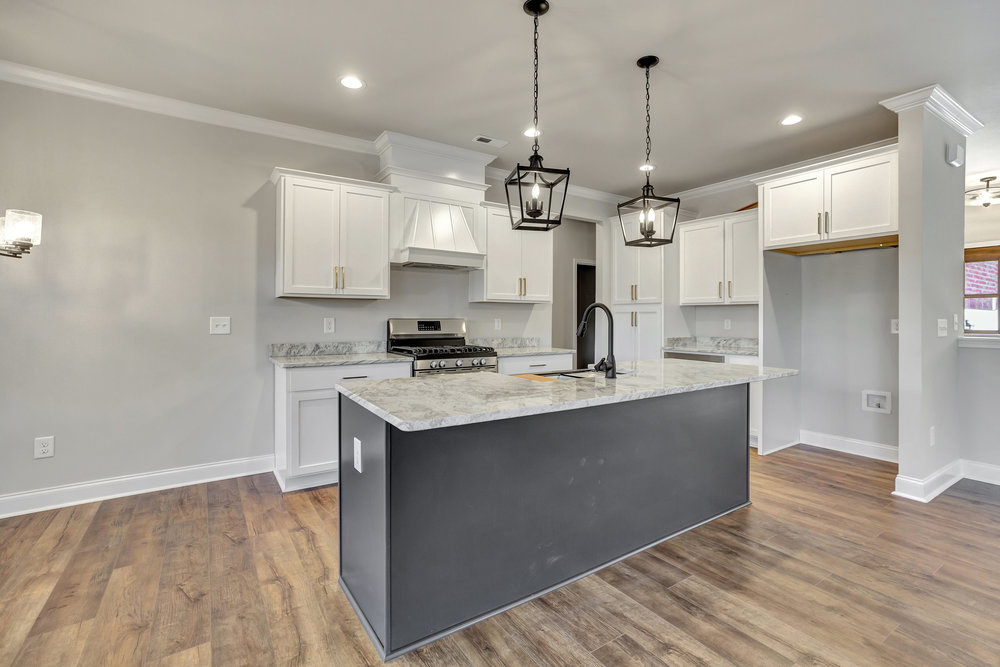 118 Bonaire Point Anderson, SC 29621 - Photo 5 of 23 This newly designed kitchen features a spacious island, elegant pendant lighting, and modern appliances.
