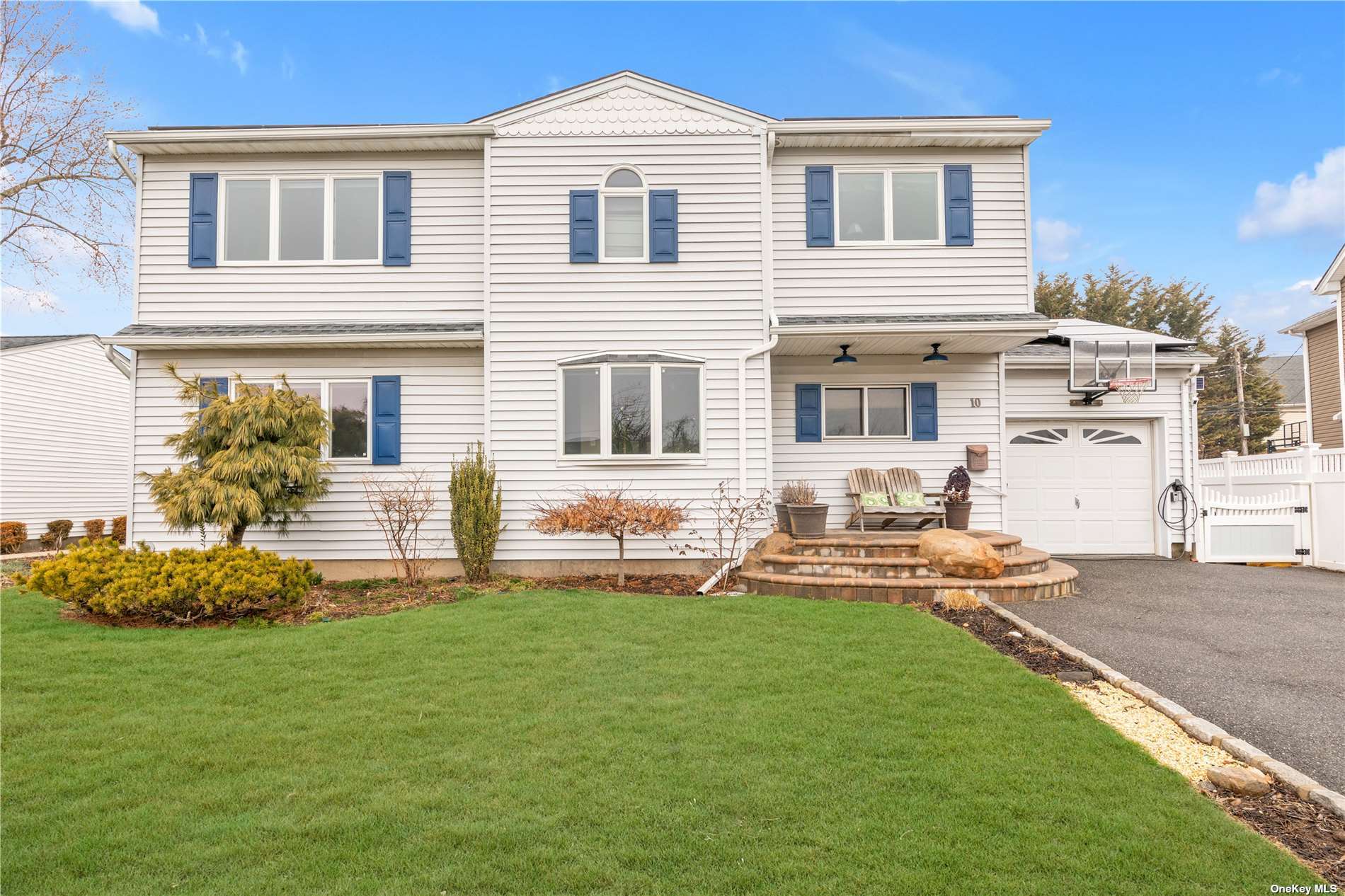 10 Lillian Lane Plainview, NY 11803 - Photo 1 of 1 a front view of a house with a yard