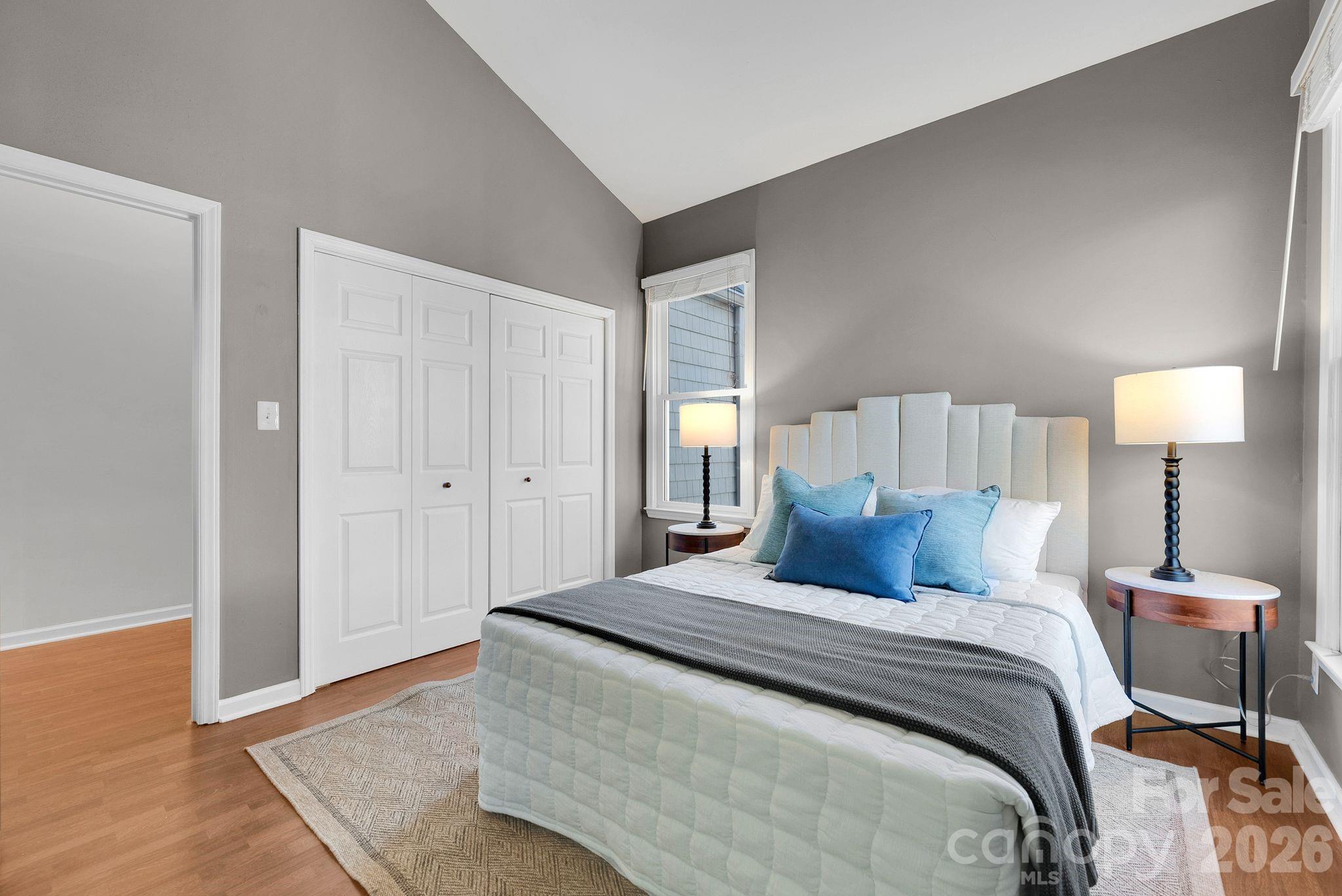 300 South Cedar Street, Unit 2 Charlotte, NC 28202 - Photo 13 of 29 a bedroom with a bed and a night stand