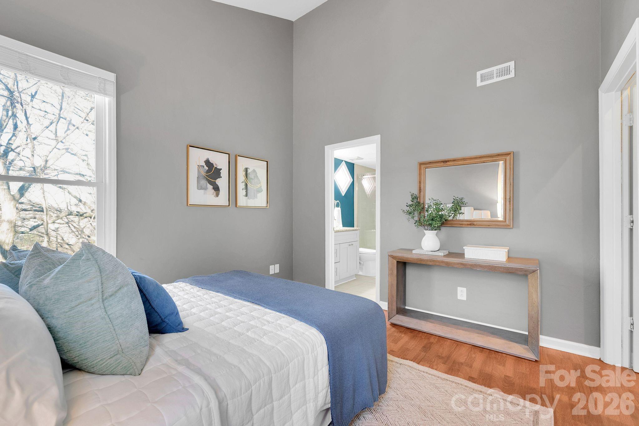 300 South Cedar Street, Unit 2 Charlotte, NC 28202 - Photo 14 of 29 a bedroom with a bed and a table