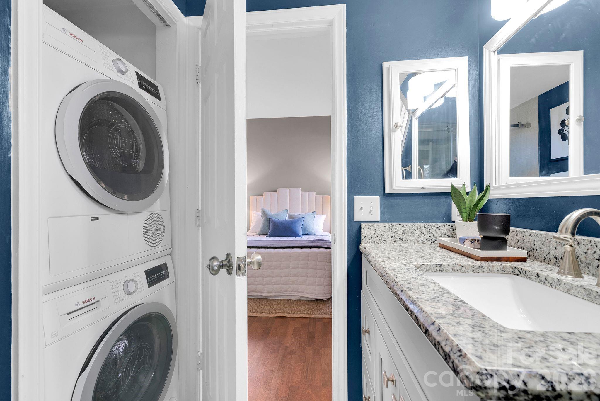 300 South Cedar Street, Unit 2 Charlotte, NC 28202 - Photo 15 of 29 a bathroom with a granite countertop sink and a mirror
