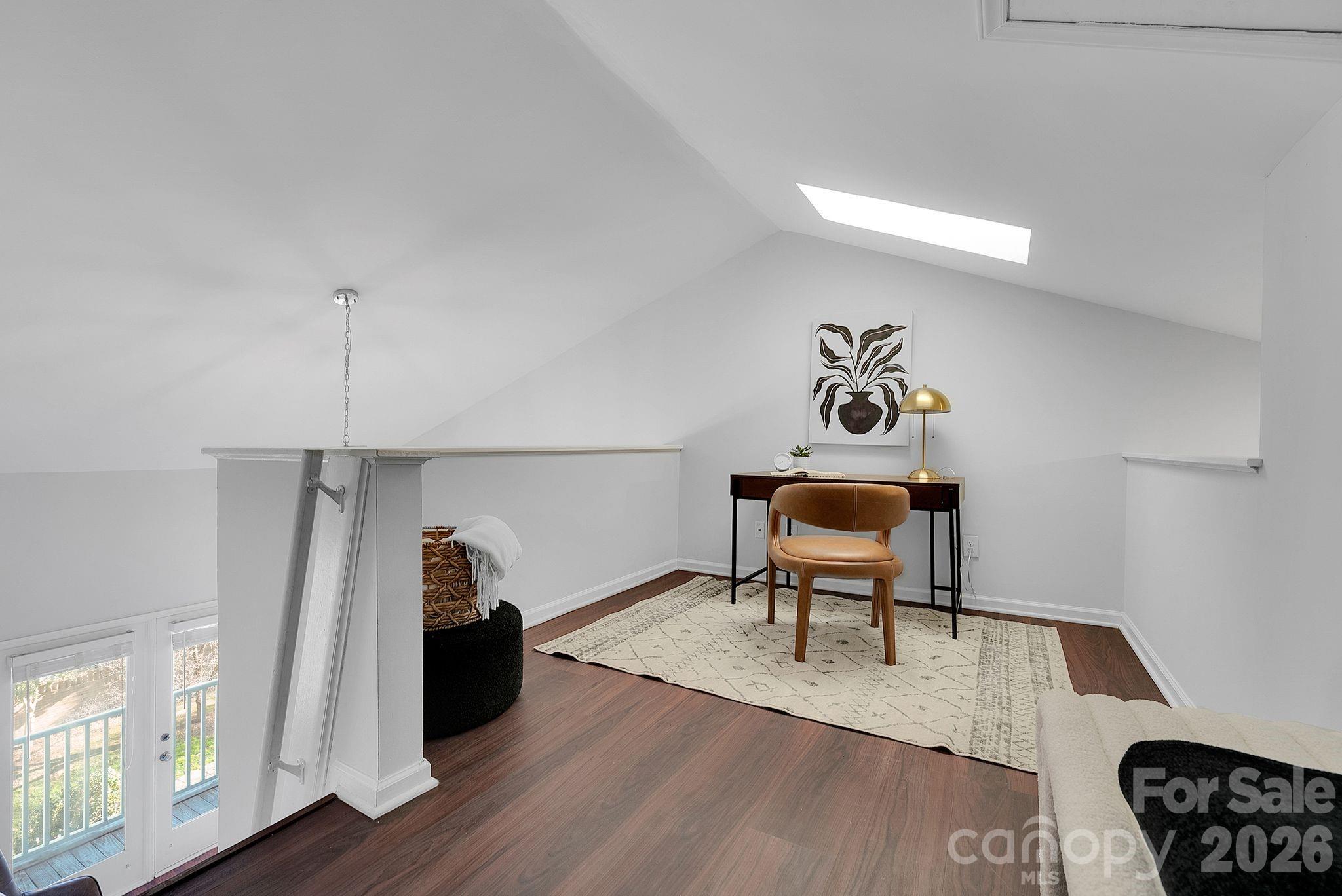 300 South Cedar Street, Unit 2 Charlotte, NC 28202 - Photo 17 of 29 a living room with furniture and a wooden floor