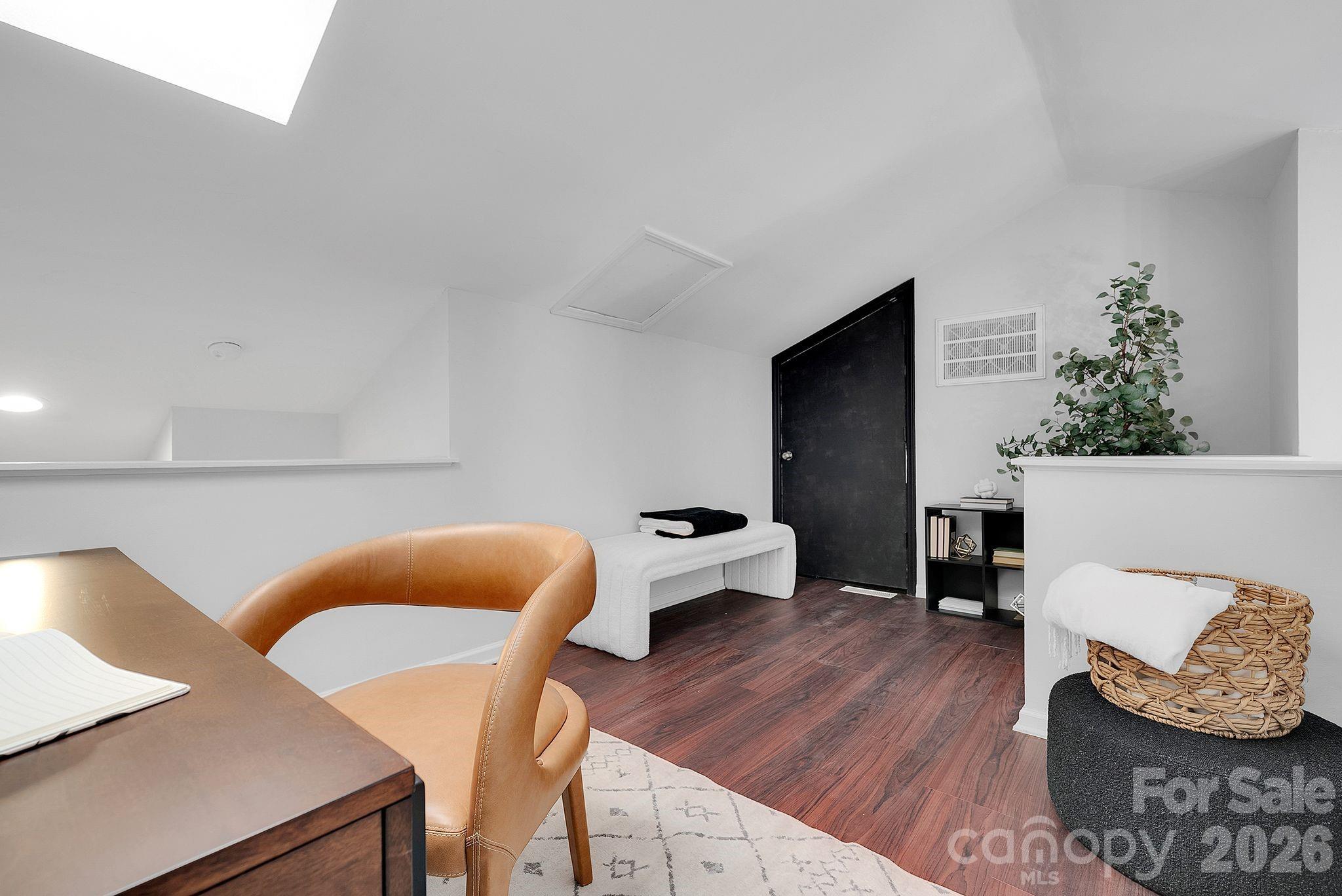 300 South Cedar Street, Unit 2 Charlotte, NC 28202 - Photo 19 of 29 a living room with furniture and wooden floor