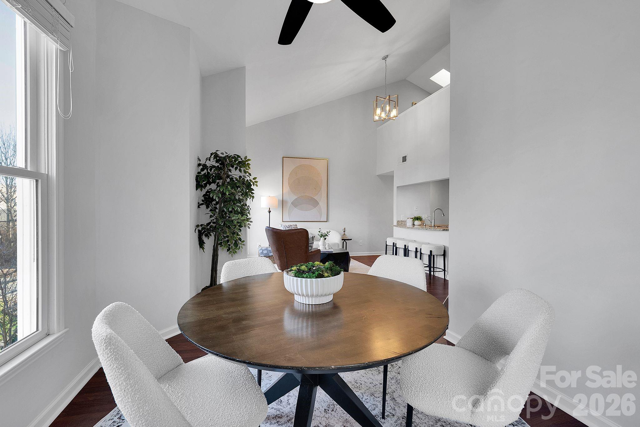 300 South Cedar Street, Unit 2 Charlotte, NC 28202 - Photo 21 of 29 a view of a dining room with furniture and a potted plant