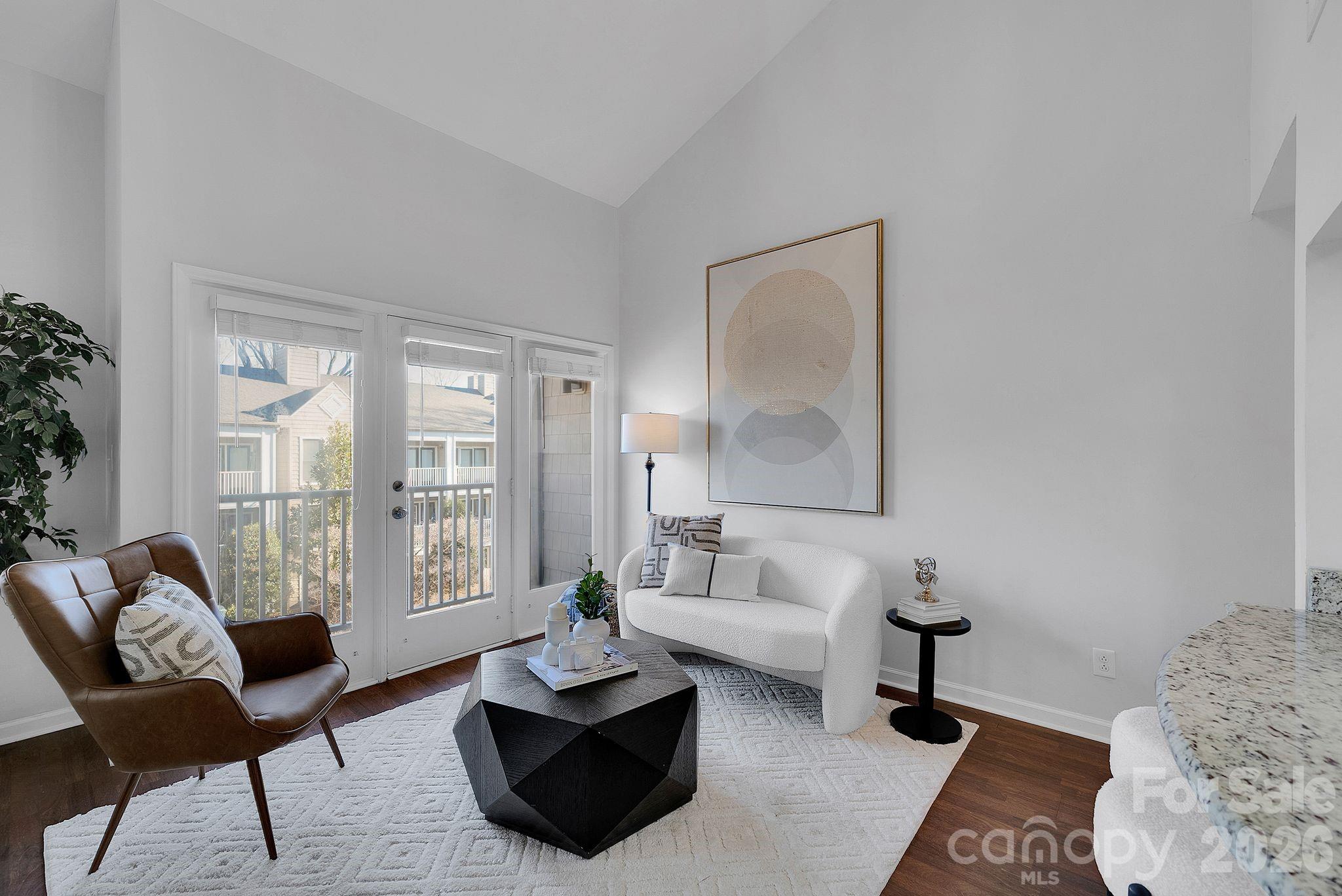 300 South Cedar Street, Unit 2 Charlotte, NC 28202 - Photo 4 of 29 a living room with furniture and a potted plant