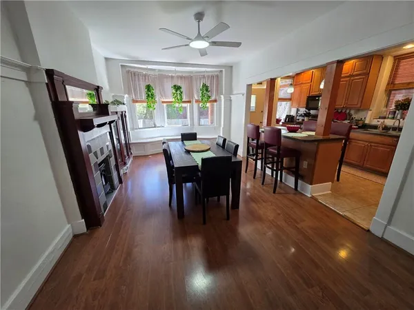 a view of a dining room with furniture window and wooden floor