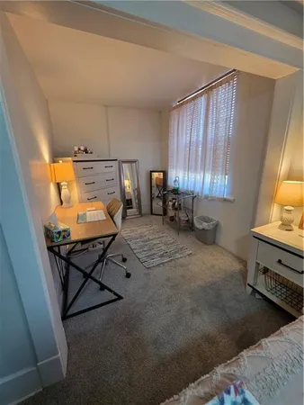 a room with furniture and window