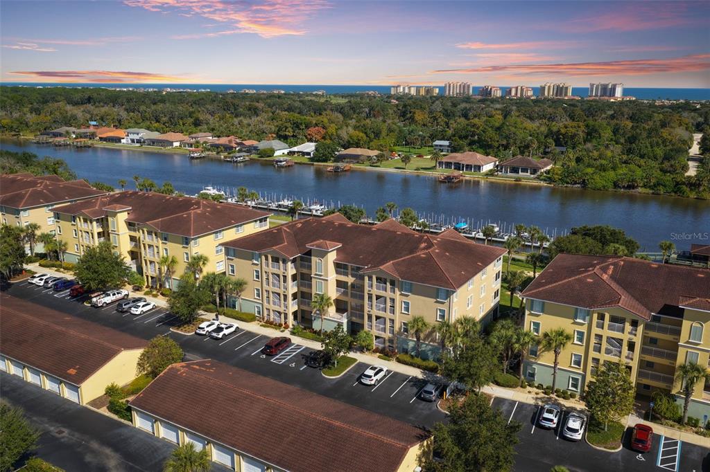 an aerial view of a house with a lake view
