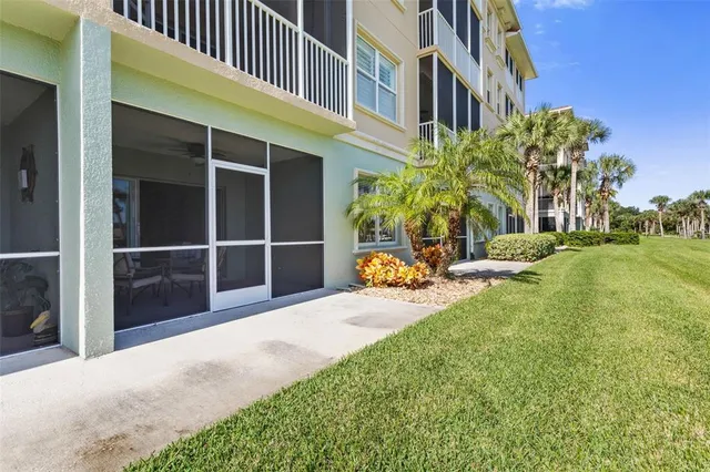 a view of a field with grass and trees
