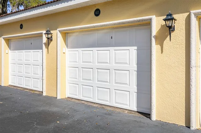 a front view of a building with a garden