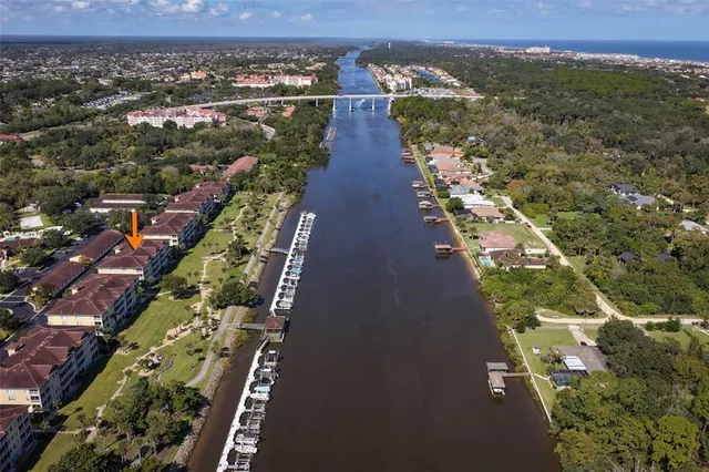 an aerial view of a swimming pool patio and outdoor seating