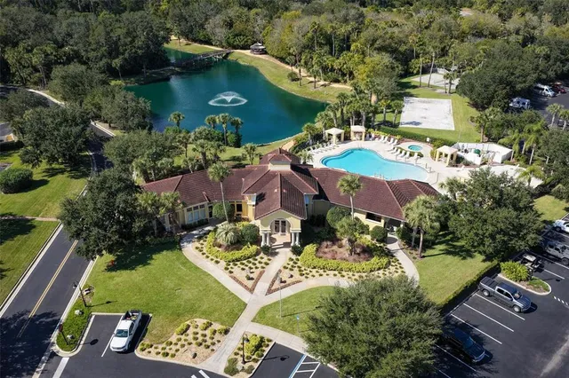 a view of a swimming pool with a yard