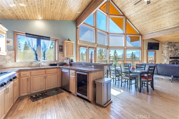 a kitchen with lots of counter top space and dining table