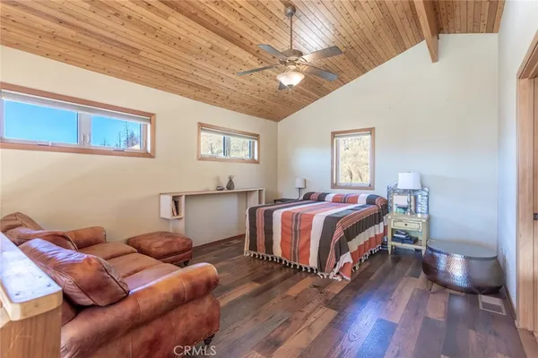 a bed room with a bed and a chair