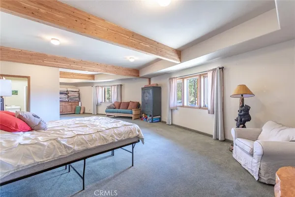 a bedroom with bed and window