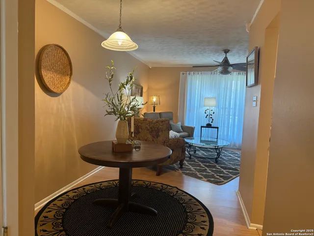 a living room with furniture and a lamp