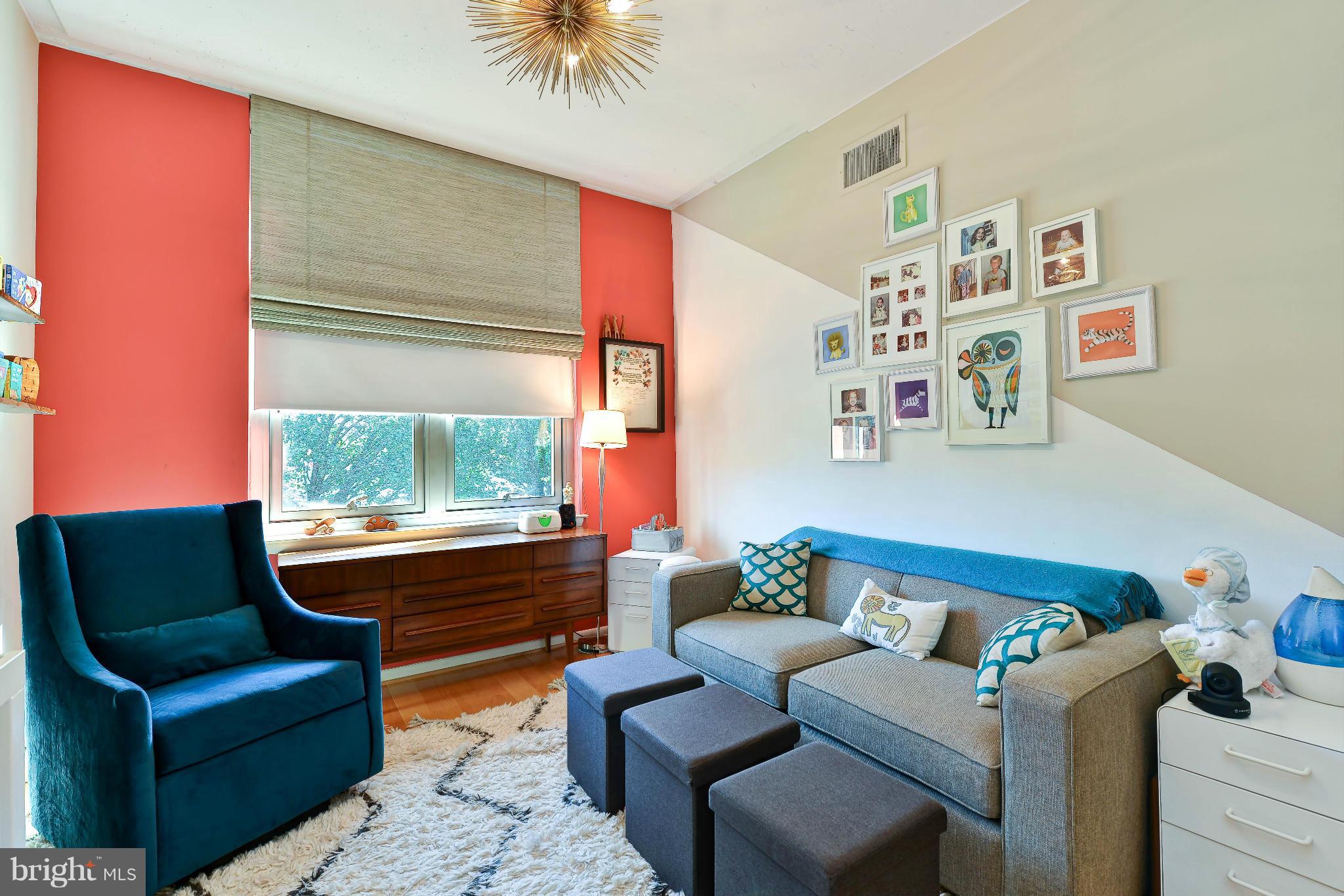 811 4th Street Northwest, Unit 218 Washington, DC 20001 - Photo 19 of 28 a living room with furniture and a large window