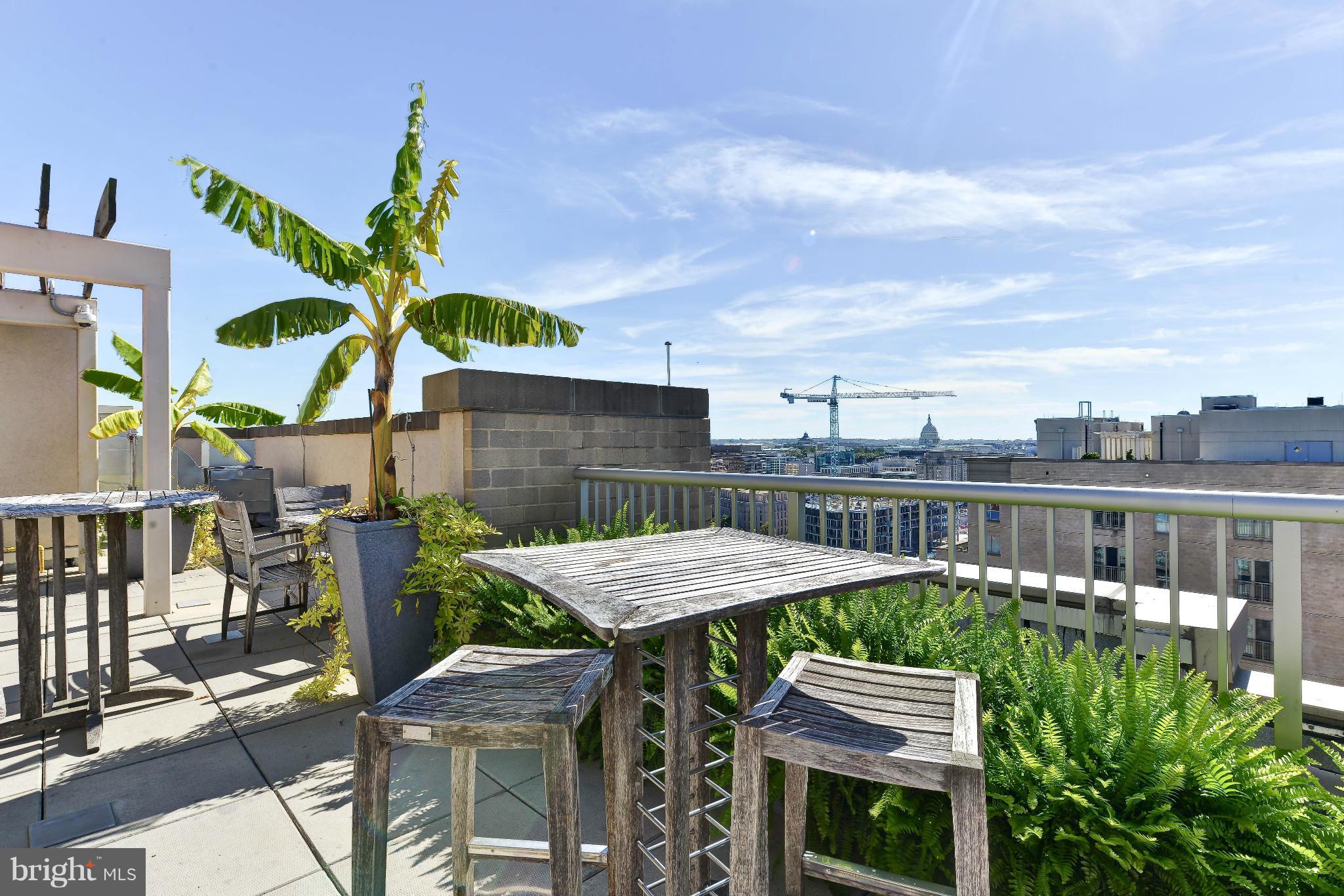 811 4th Street Northwest, Unit 218 Washington, DC 20001 - Photo 27 of 28 a view of a patio with a table and chairs