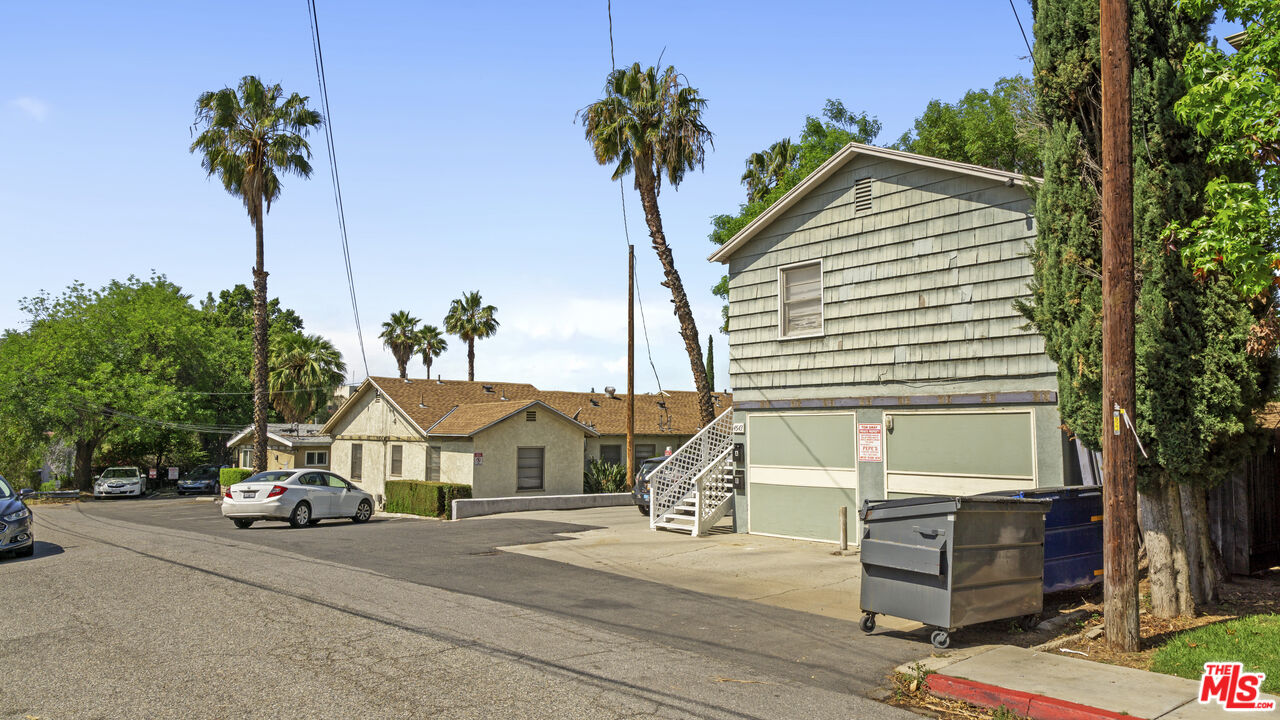4561 Main Street Riverside, CA 92501 - Photo 2 of 8 a view of a house with a yard and a street