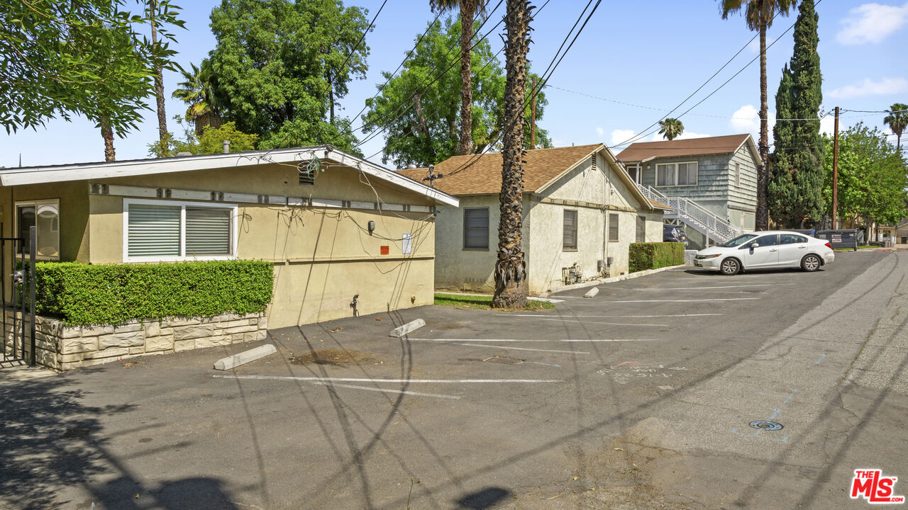 4561 Main Street Riverside, CA 92501 - Photo 3 of 8 a view of a street with house and a trees