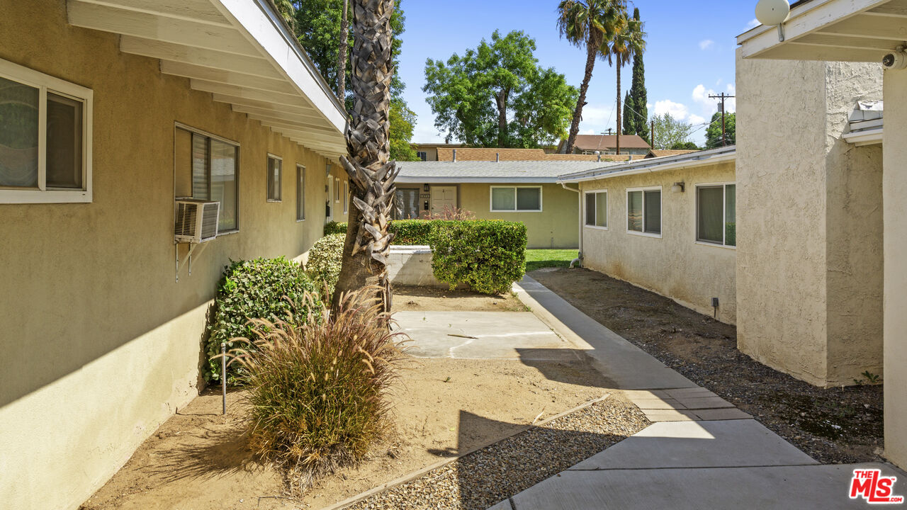 4561 Main Street Riverside, CA 92501 - Photo 4 of 8 a front view of a house with a yard