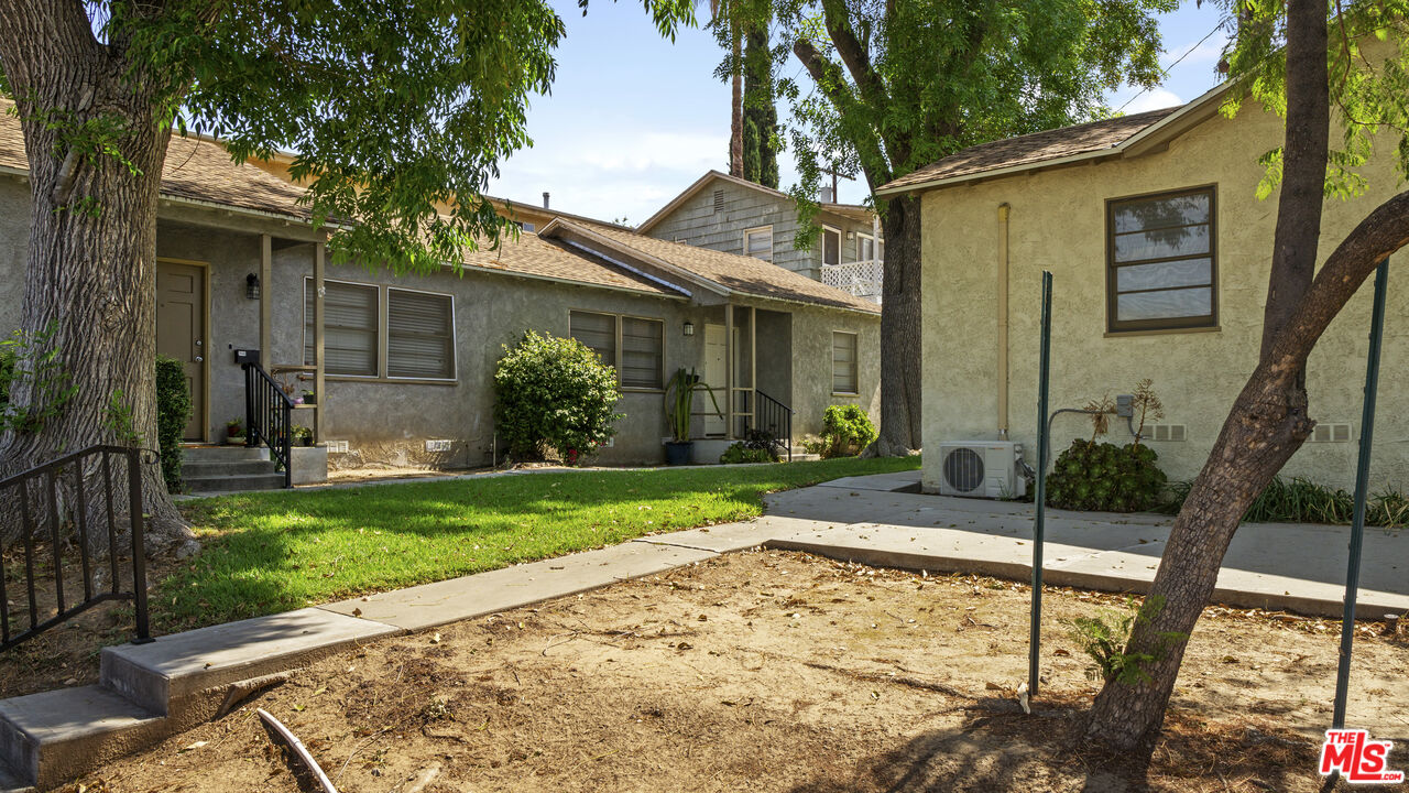 4561 Main Street Riverside, CA 92501 - Photo 5 of 8 a view of a house with backyard