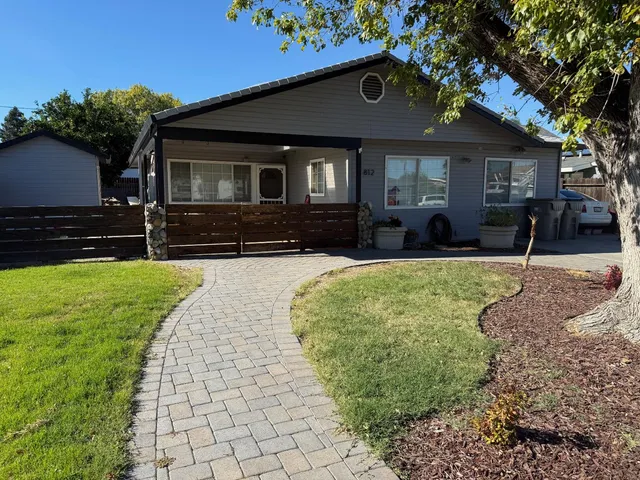 a front view of a house with a yard