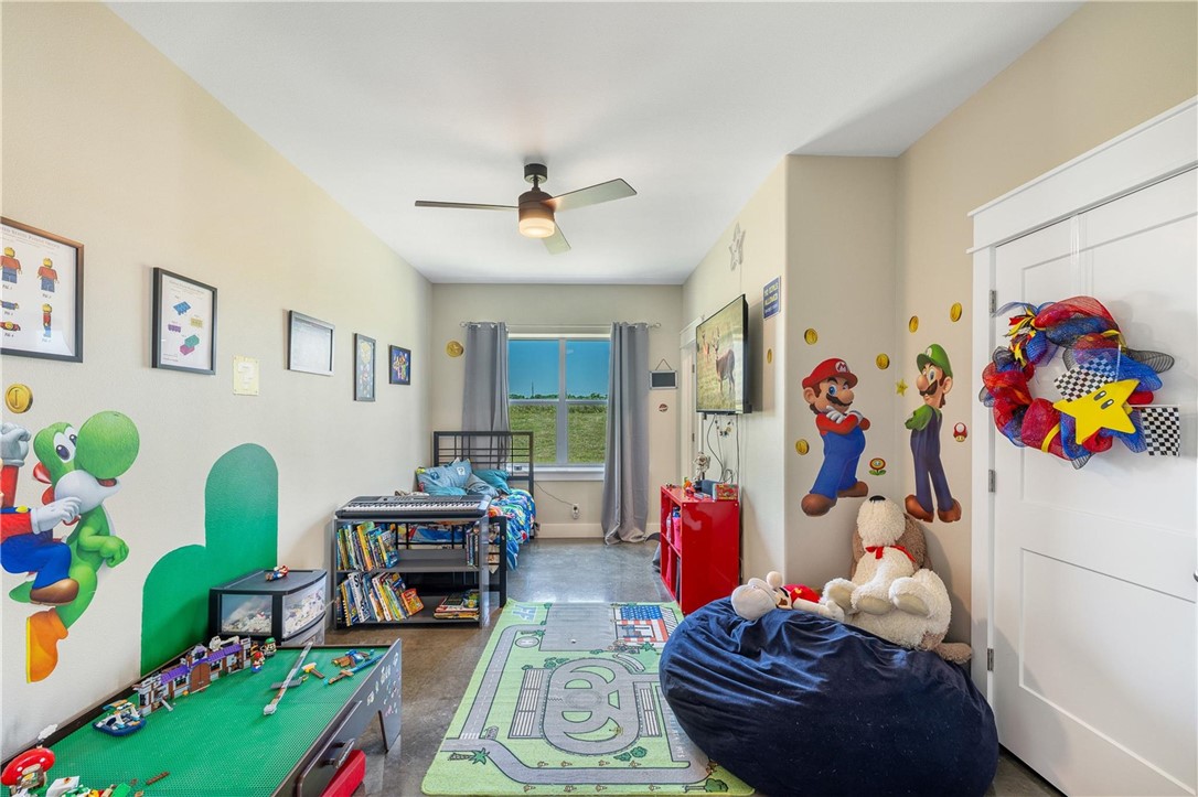 4330 Post Oak Point Road New Ulm, TX 78950 - Photo 16 of 43 a living room with lots of furniture and toys