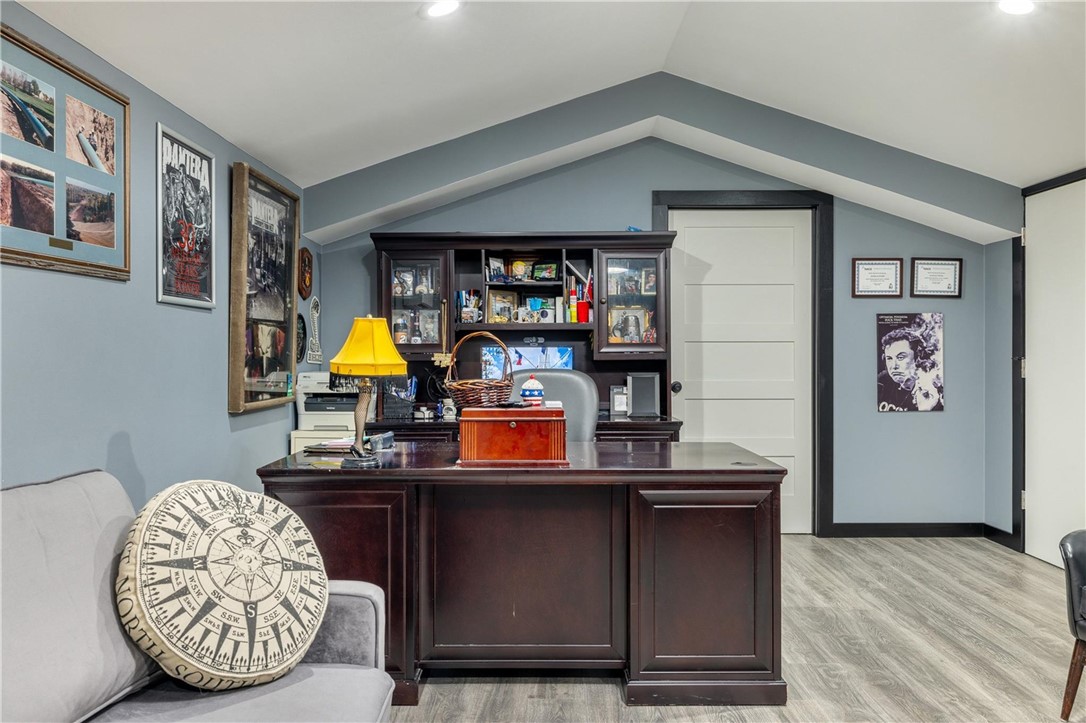 4330 Post Oak Point Road New Ulm, TX 78950 - Photo 18 of 43 a room with wooden floor and furniture