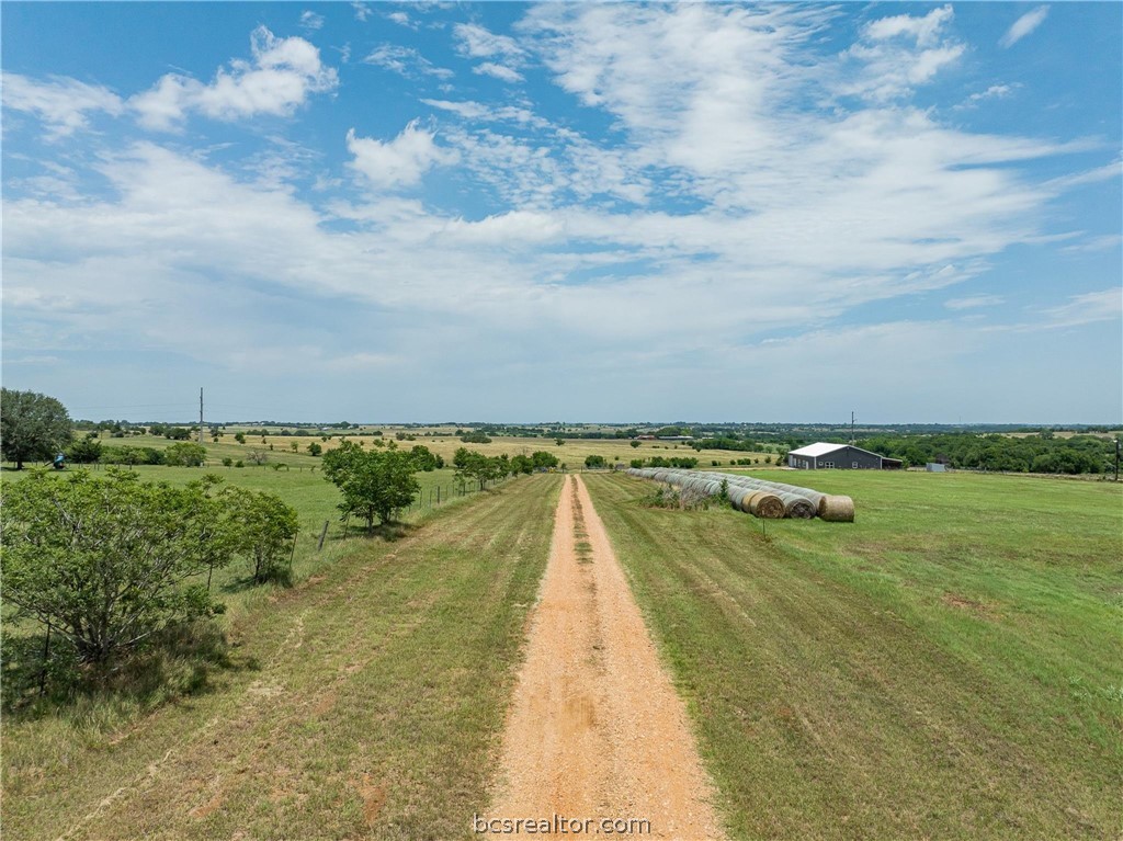 4330 Post Oak Point Road New Ulm, TX 78950 - Photo 2 of 43 a view of swimming pool with outdoor seating and yard in back