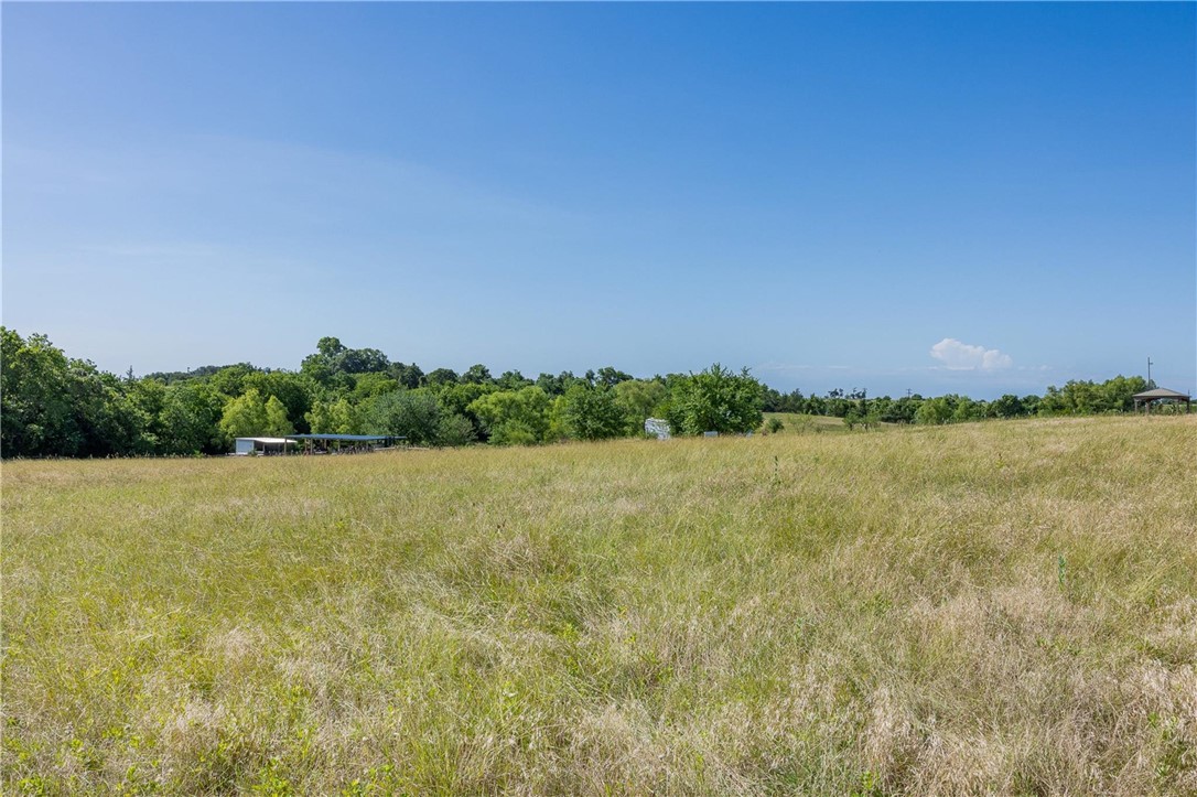 4330 Post Oak Point Road New Ulm, TX 78950 - Photo 22 of 43 a view of a lake and green valley