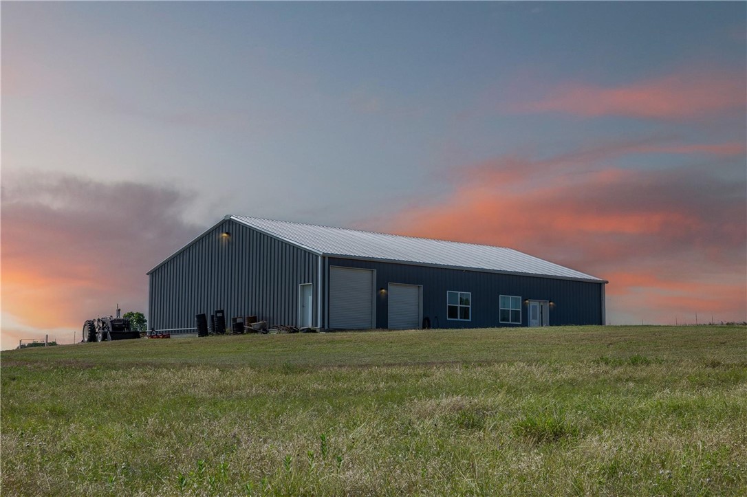 4330 Post Oak Point Road New Ulm, TX 78950 - Photo 27 of 43 a front view of house with a garden