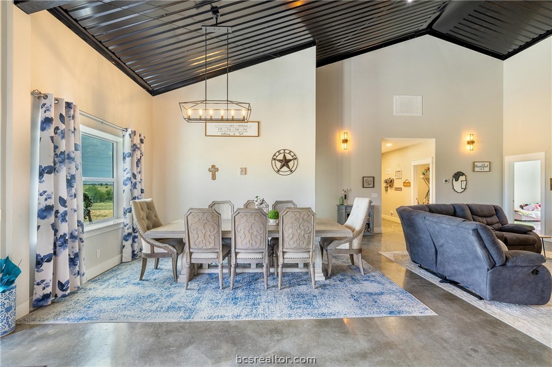 4330 Post Oak Point Road New Ulm, TX 78950 - Photo 7 of 43 a dining room with furniture and wooden floor