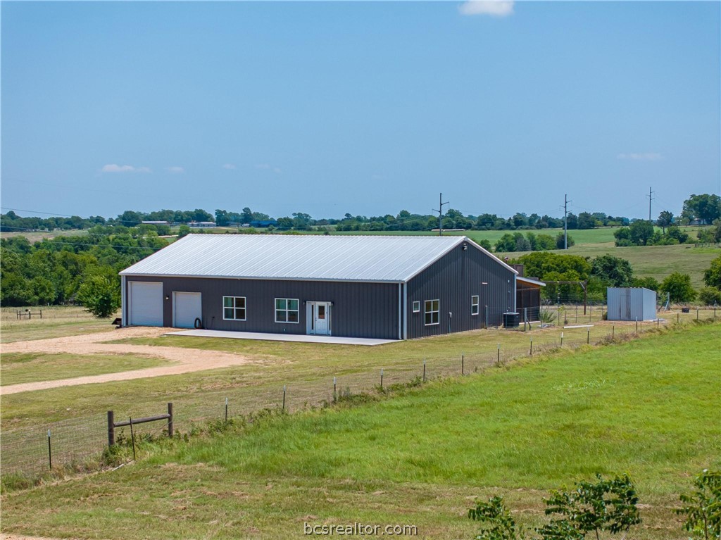 4330 Post Oak Point Road New Ulm, TX 78950 - Photo 9 of 43 a front view of a house with a yard