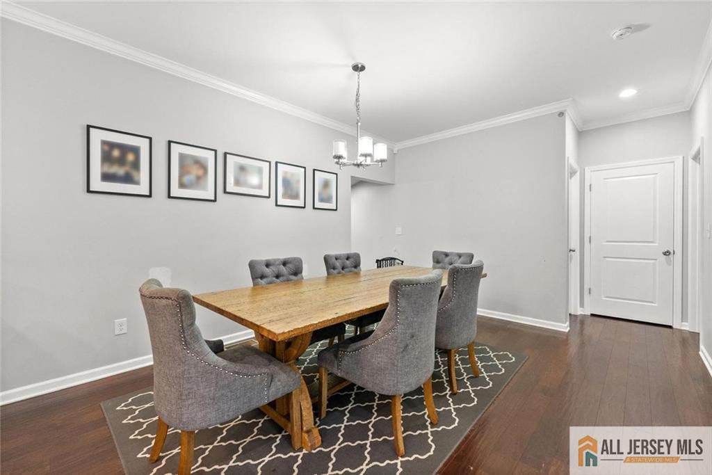 227 Temple Way Colonia, NJ 07067 - Photo 12 of 30 a view of a dining room with furniture window and wooden floor
