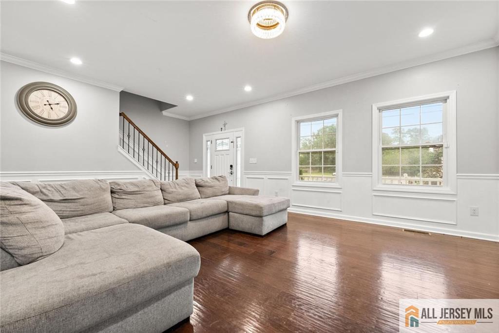 227 Temple Way Colonia, NJ 07067 - Photo 16 of 30 a living room with furniture and a large window